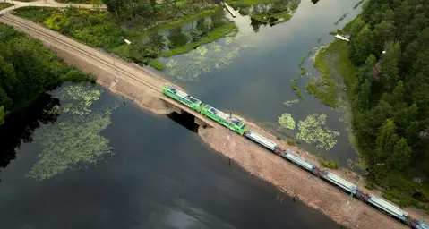 Train passing over a lake. Is your company looking for a climate-smart way to transport your goods?